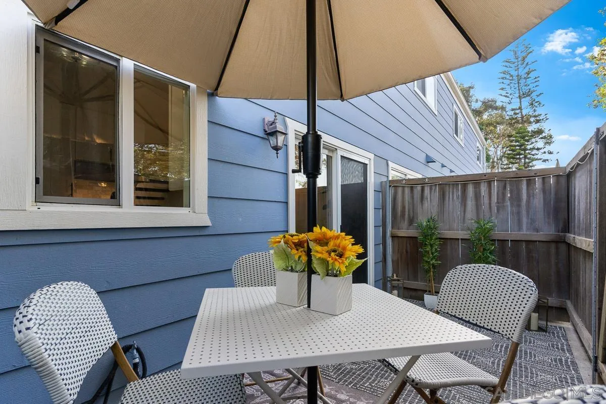 981 North Vulcan Avenue, Unit 4 Encinitas, CA 92024 - Photo 22 of 24 a table and chairs in patio of the house