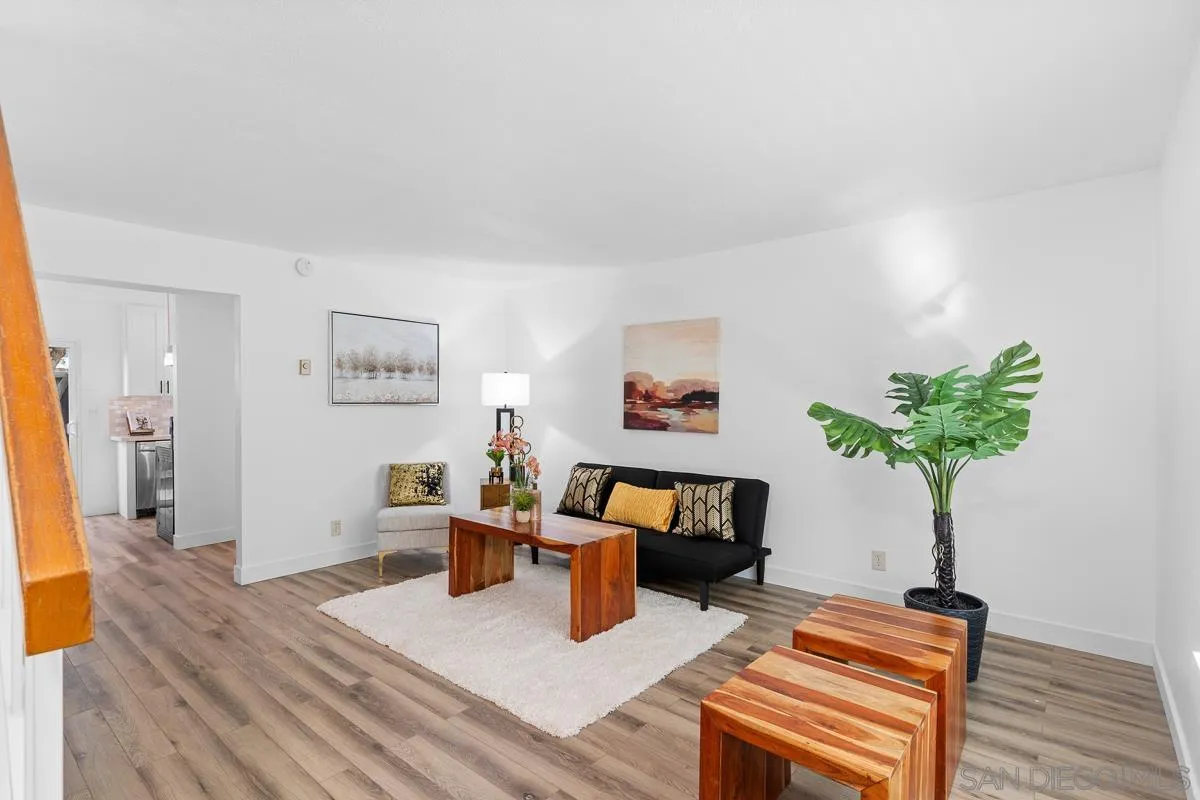 981 North Vulcan Avenue, Unit 4 Encinitas, CA 92024 - Photo 3 of 24 a living room with furniture and a potted plant