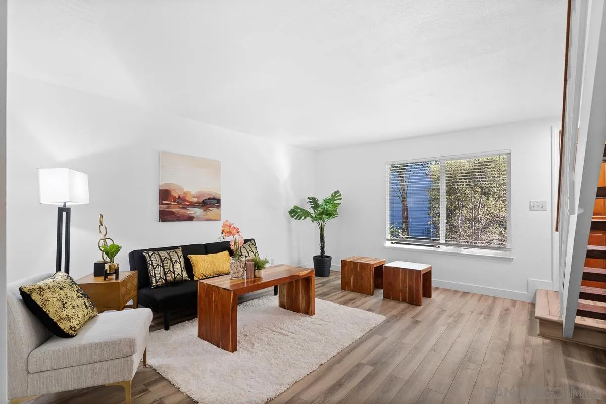 981 North Vulcan Avenue, Unit 4 Encinitas, CA 92024 - Photo 5 of 24 a living room with furniture and a window