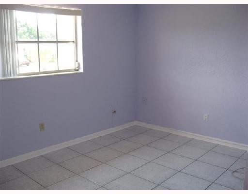 6301 Southwest 3rd Street Pompano Beach, FL 33068 - Photo 4 of 13 an empty room with a window
