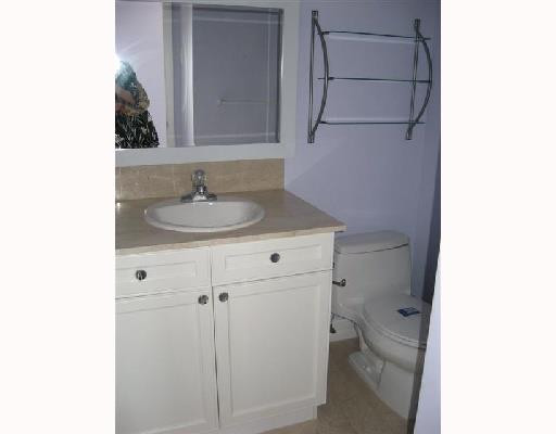 6301 Southwest 3rd Street Pompano Beach, FL 33068 - Photo 5 of 13 a bathroom with a sink and a toilet
