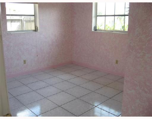 6301 Southwest 3rd Street Pompano Beach, FL 33068 - Photo 8 of 13 an empty room with windows