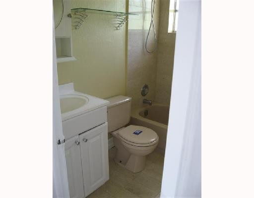 6301 Southwest 3rd Street Pompano Beach, FL 33068 - Photo 9 of 13 a bathroom with a toilet and a sink