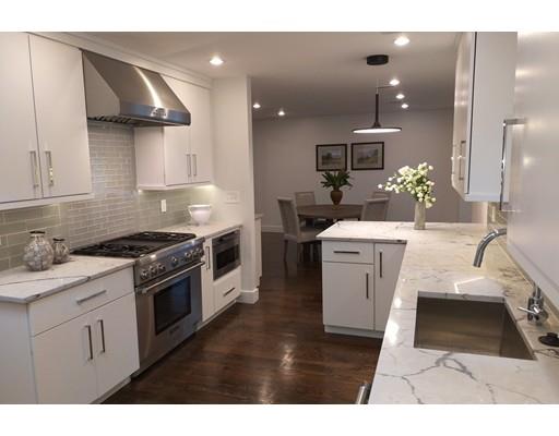 a kitchen with a sink stainless steel appliances and cabinets