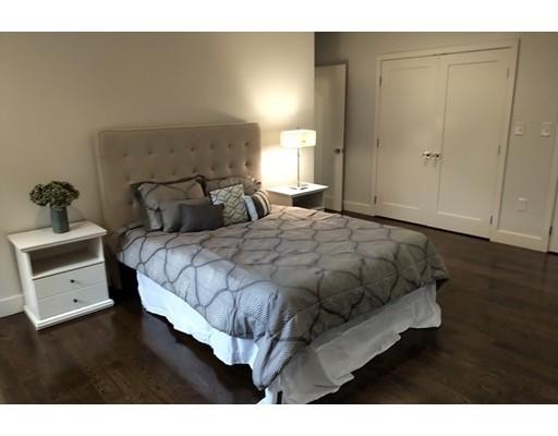 60 Woodcliff Road Brookline, MA 02467 - Photo 13 of 30 a bedroom with a bed and window