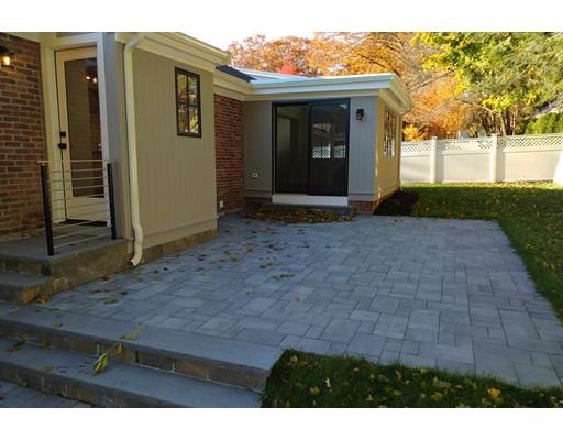60 Woodcliff Road Brookline, MA 02467 - Photo 24 of 30 a view of a brick house with a yard