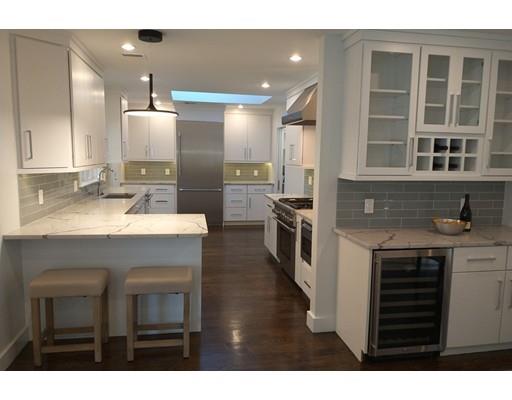 60 Woodcliff Road Brookline, MA 02467 - Photo 3 of 30 a kitchen with kitchen island a sink stainless steel appliances and cabinets