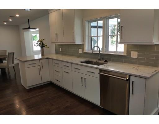 60 Woodcliff Road Brookline, MA 02467 - Photo 4 of 30 a kitchen with a sink cabinets and window