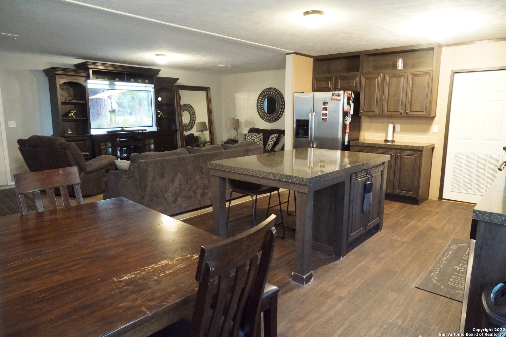 10179 Commerce Street Atascosa, TX 78002 - Photo 7 of 12 a living room with furniture and wooden floor