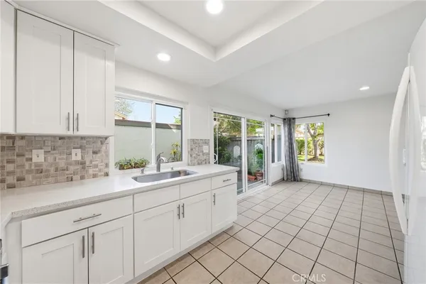 a kitchen with a sink and cabinets