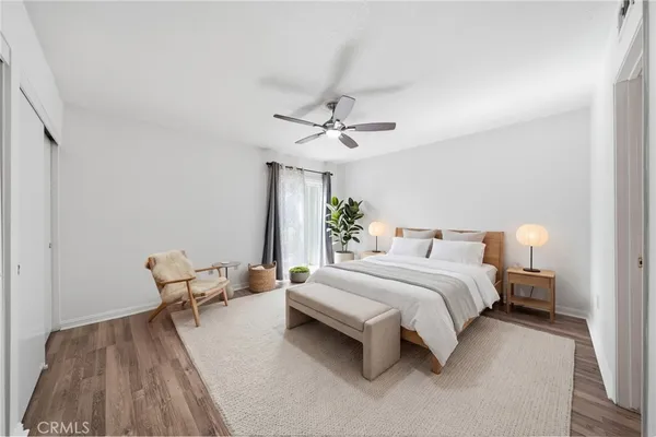 a bedroom with bed and furniture