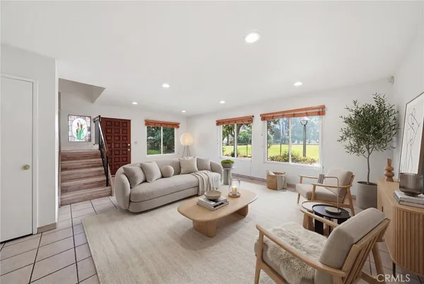 a living room with furniture and a large window