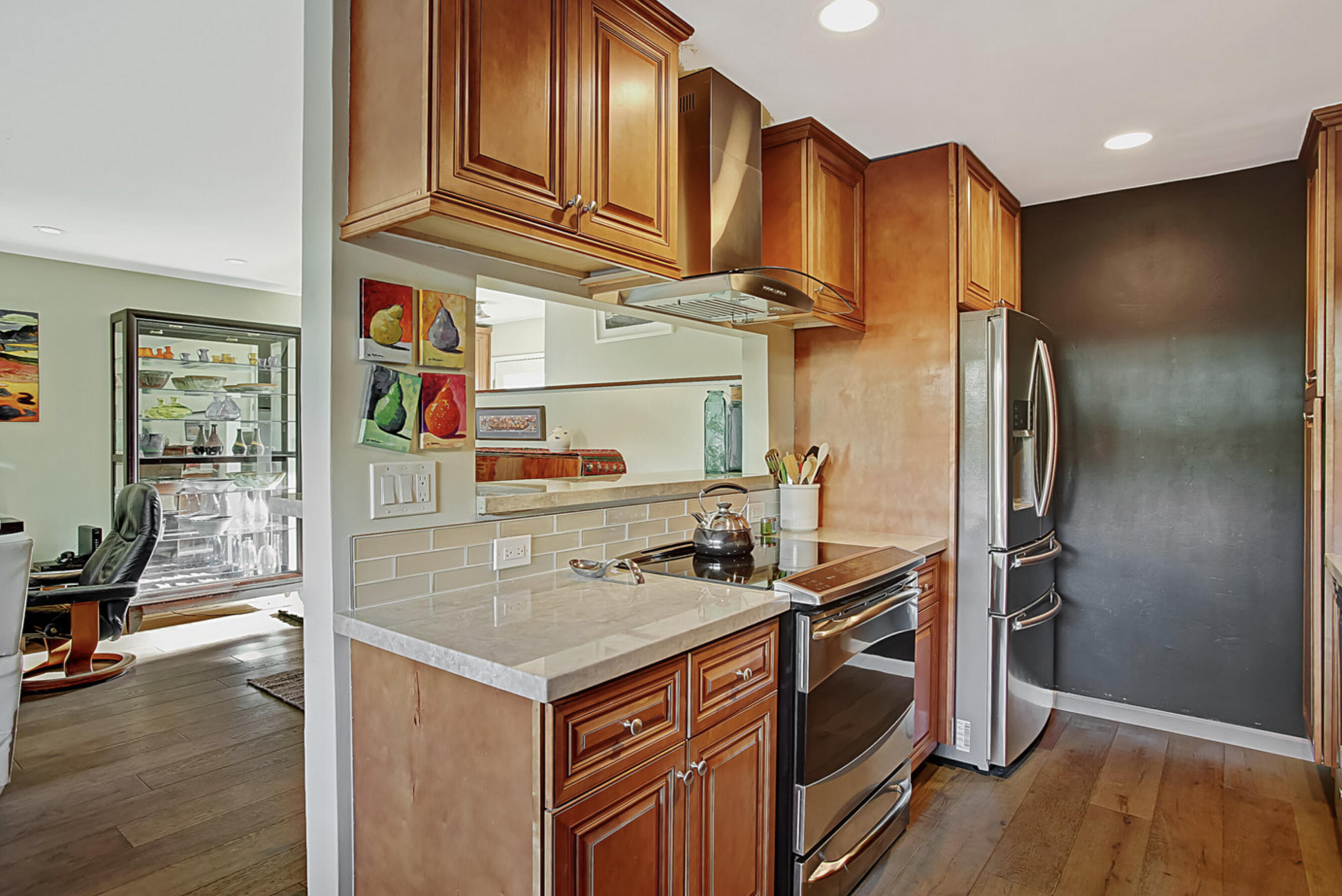 669 Del Parque Drive, Unit D Santa Barbara, CA 93103 - Photo 11 of 37 a kitchen with stainless steel appliances granite countertop a sink a stove and a refrigerator