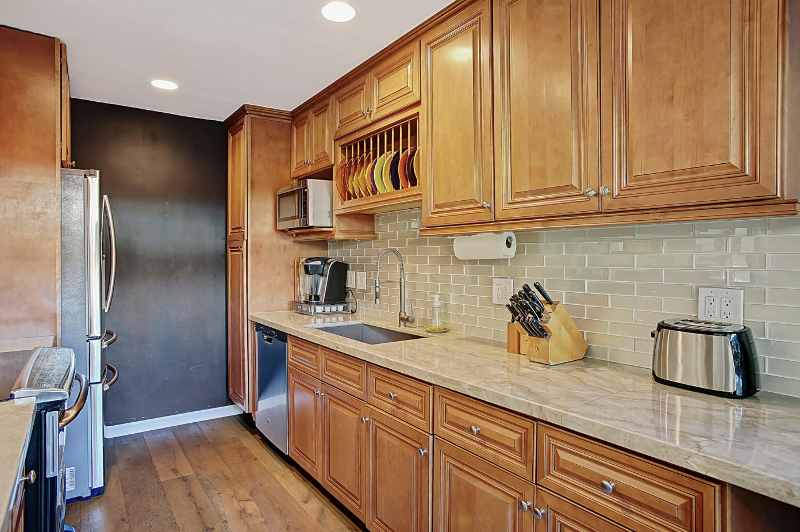 669 Del Parque Drive, Unit D Santa Barbara, CA 93103 - Photo 12 of 37 a kitchen with stainless steel appliances granite countertop a sink and cabinets