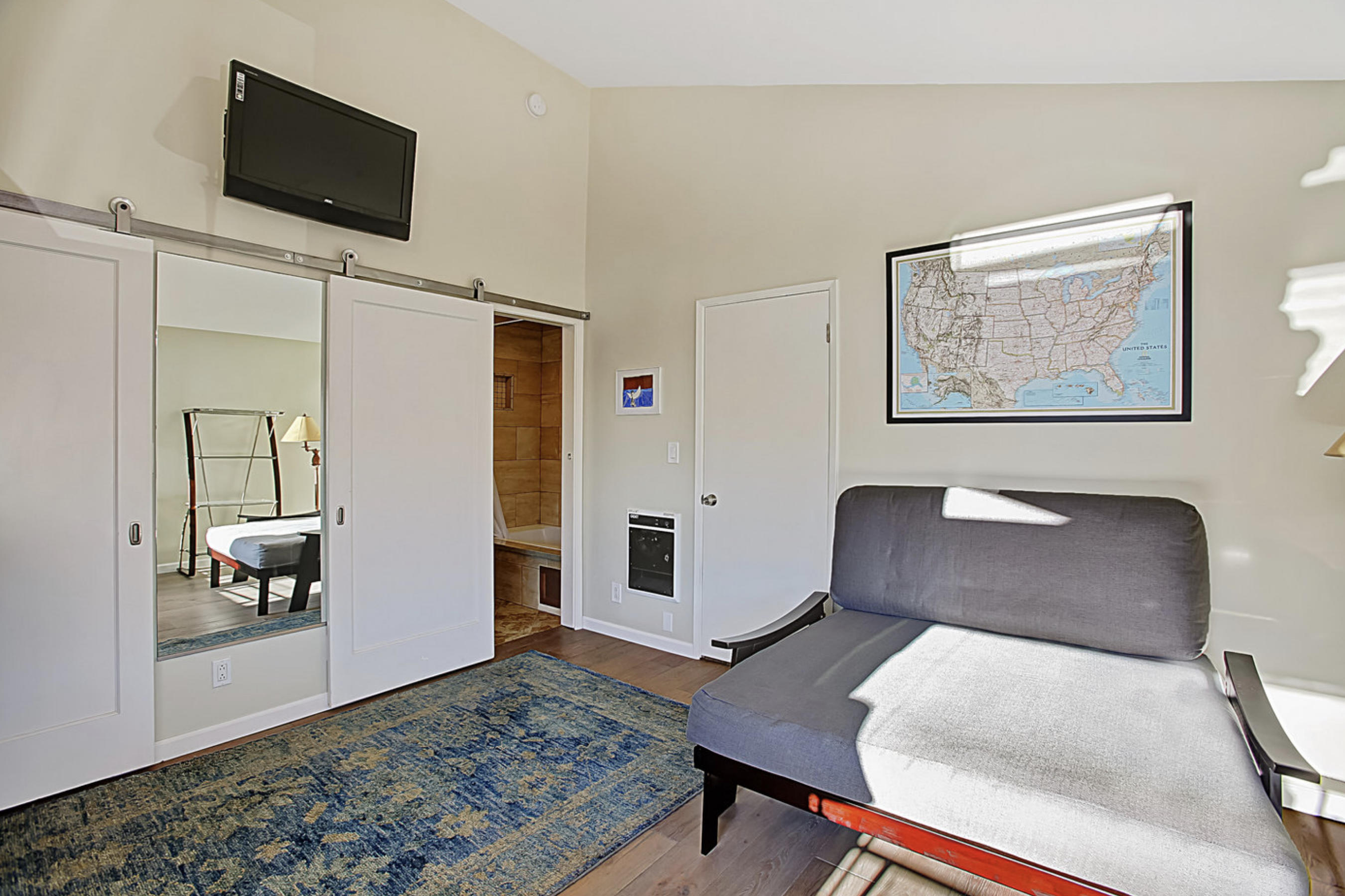 669 Del Parque Drive, Unit D Santa Barbara, CA 93103 - Photo 14 of 37 a workspace with furniture and wooden floor