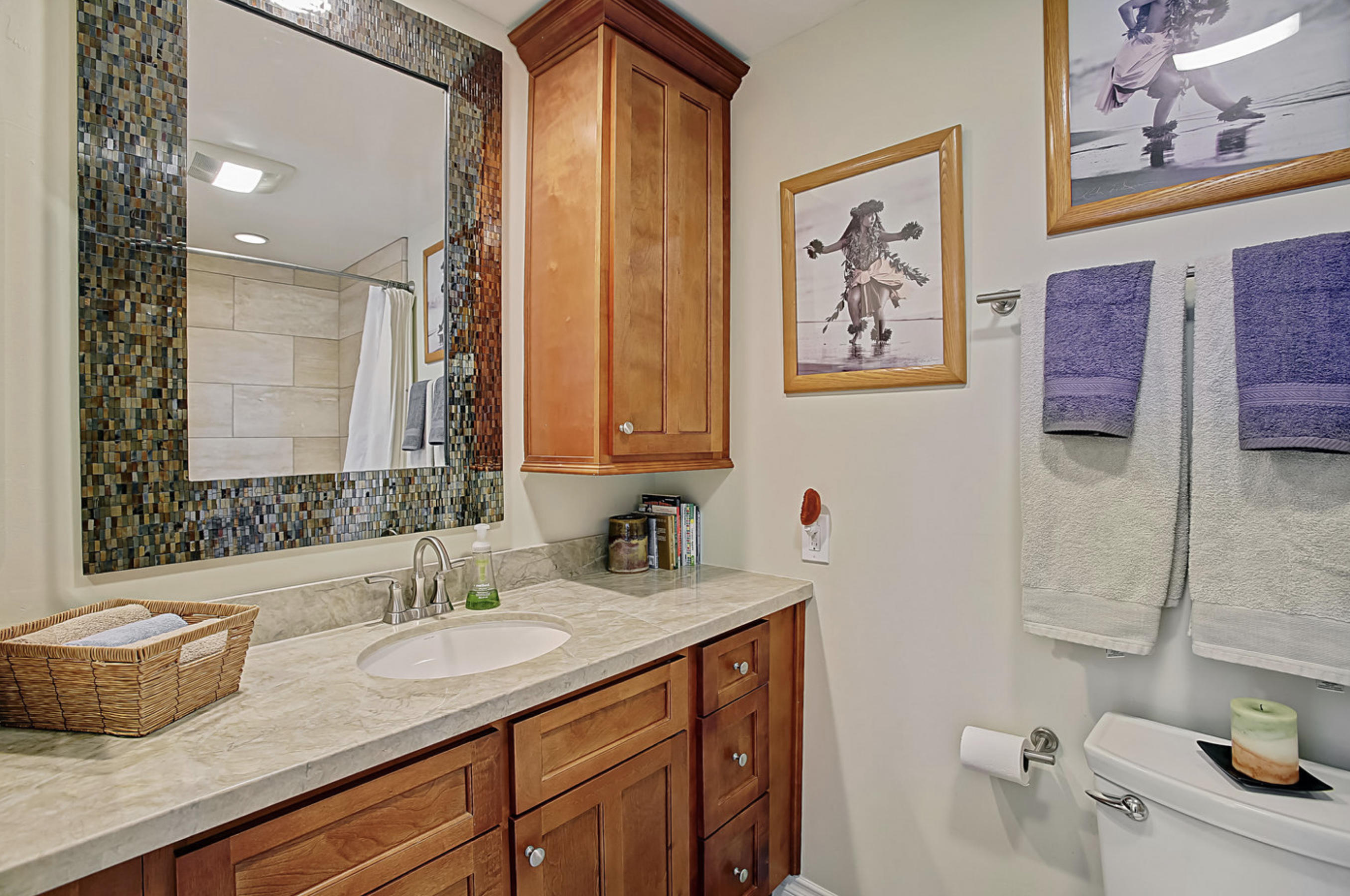 669 Del Parque Drive, Unit D Santa Barbara, CA 93103 - Photo 15 of 37 a bathroom with a granite countertop sink and a mirror