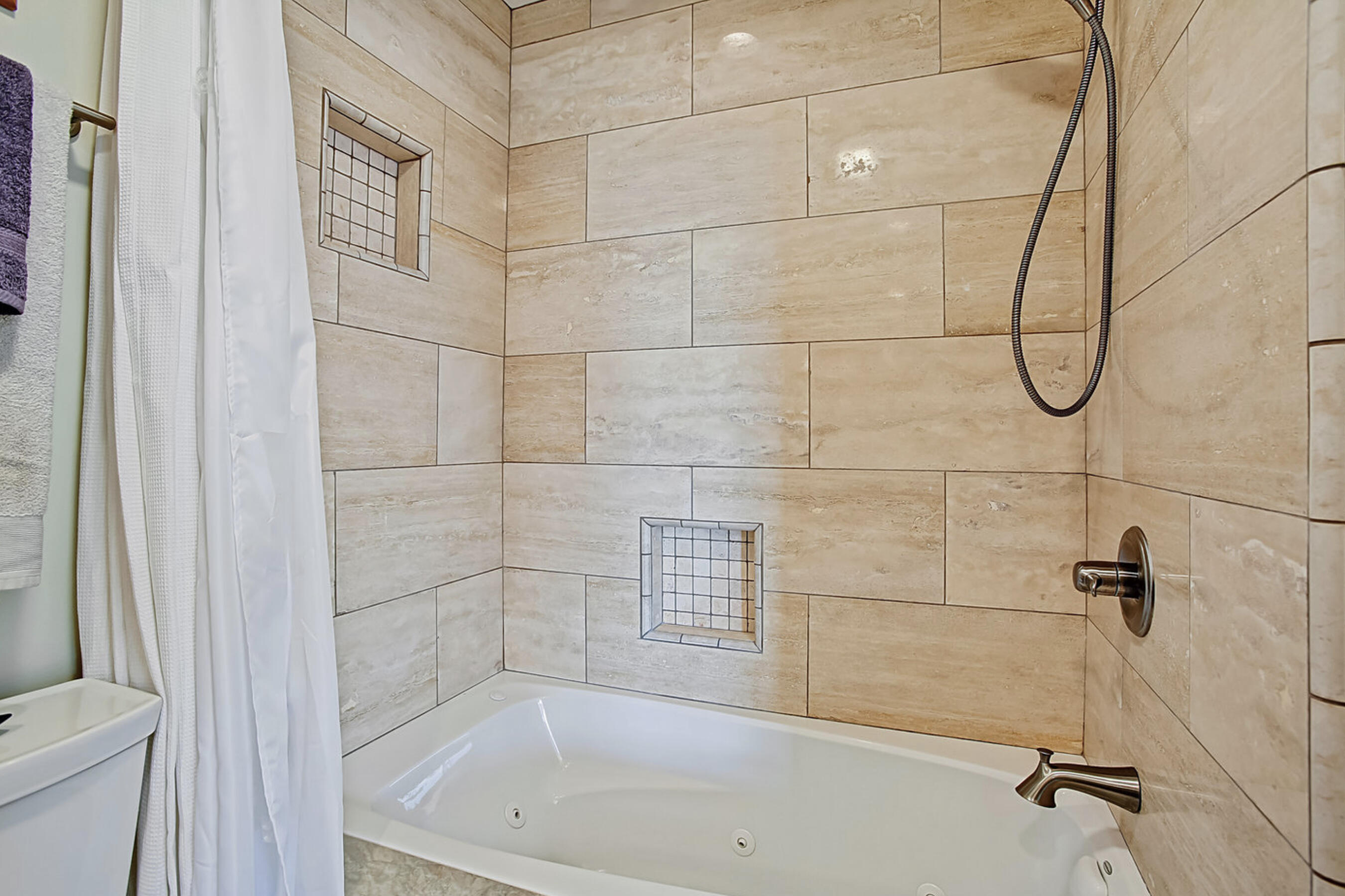 669 Del Parque Drive, Unit D Santa Barbara, CA 93103 - Photo 16 of 37 a bathroom with a bath tub with a shower