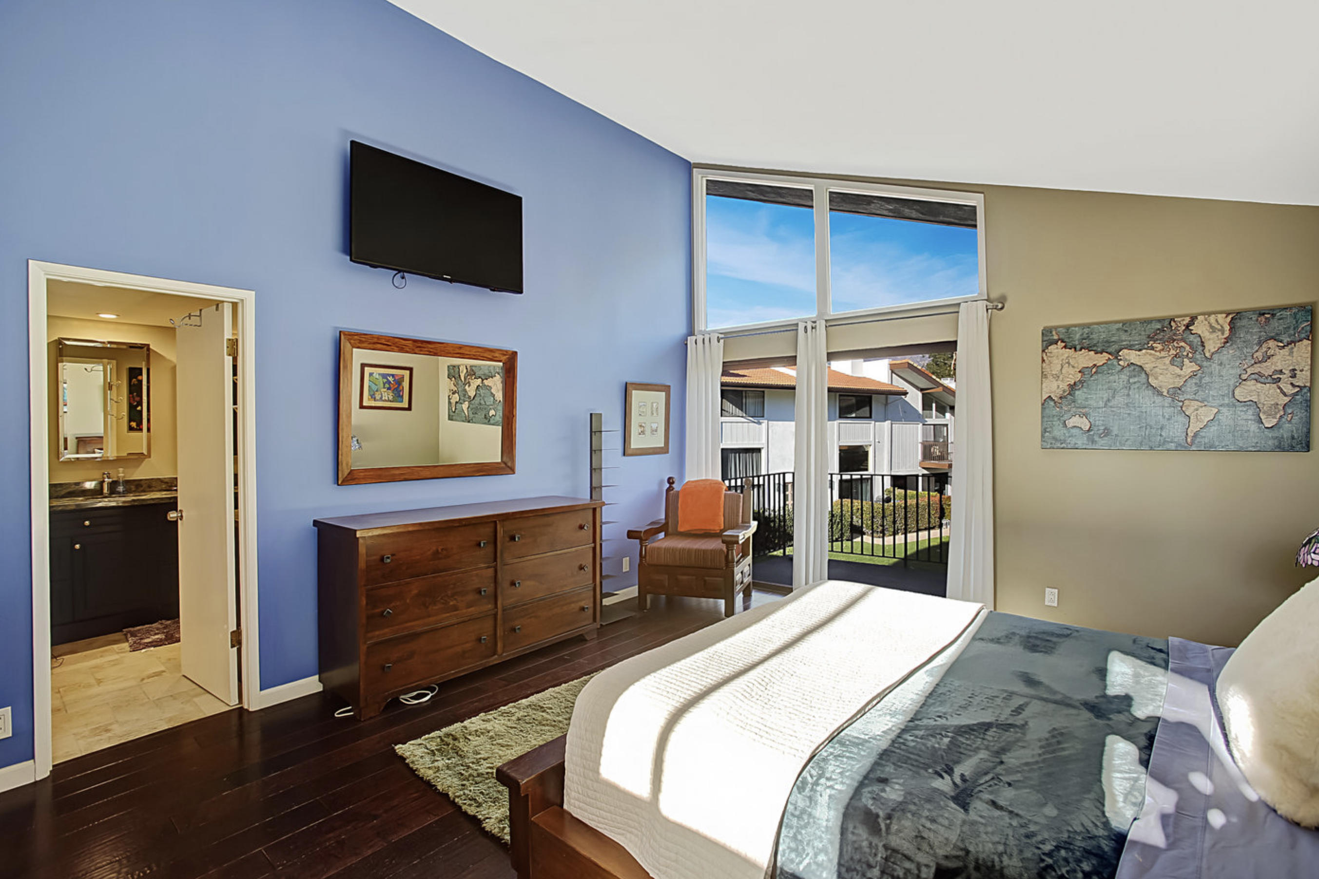 669 Del Parque Drive, Unit D Santa Barbara, CA 93103 - Photo 18 of 37 a bedroom with a bed and wooden floor