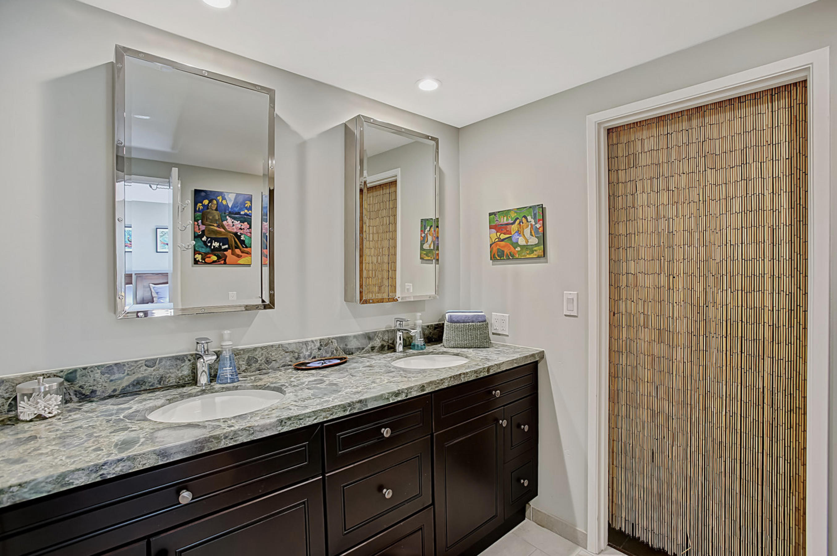 669 Del Parque Drive, Unit D Santa Barbara, CA 93103 - Photo 22 of 37 a bathroom with a granite countertop sink a mirror and a shower