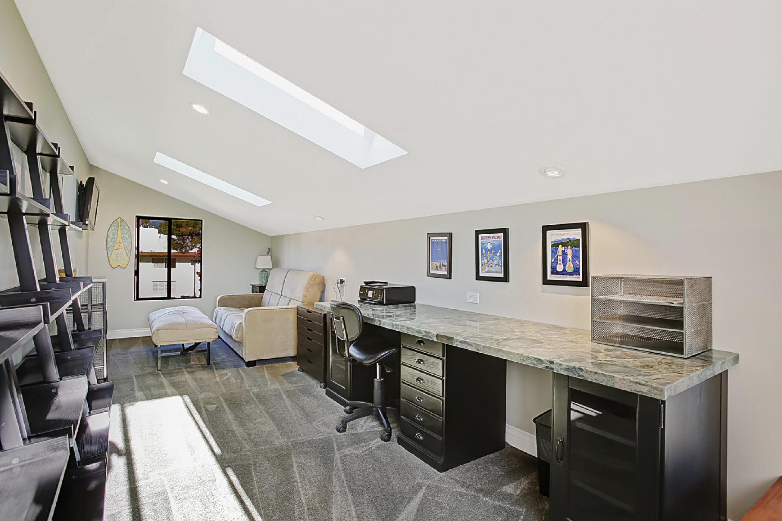 669 Del Parque Drive, Unit D Santa Barbara, CA 93103 - Photo 24 of 37 a living room with granite countertop furniture and a flat screen tv