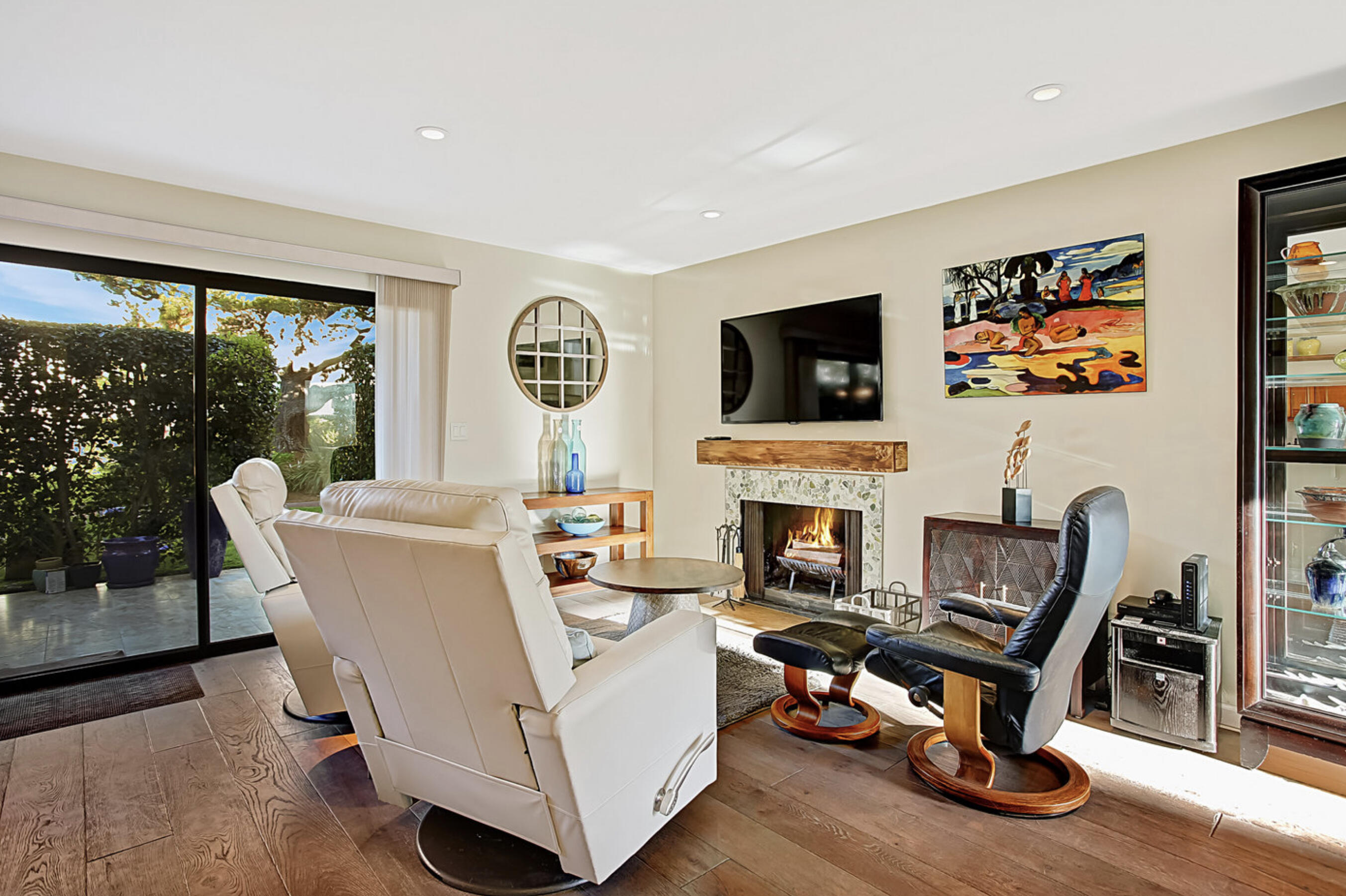 669 Del Parque Drive, Unit D Santa Barbara, CA 93103 - Photo 5 of 37 a living room with furniture a fireplace and a flat screen tv