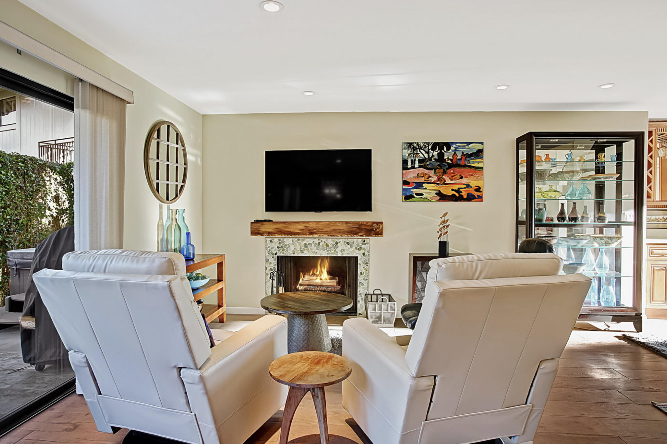 669 Del Parque Drive, Unit D Santa Barbara, CA 93103 - Photo 6 of 37 a living room with furniture a fireplace and a flat screen tv