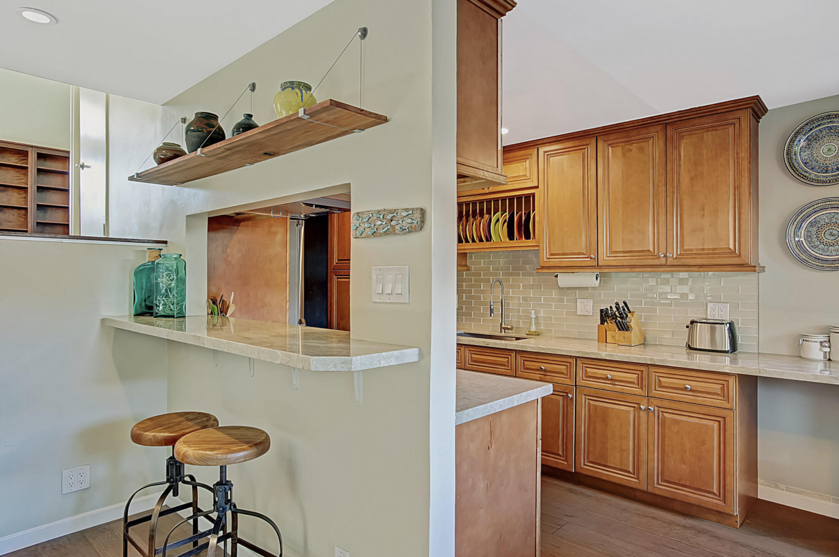 669 Del Parque Drive, Unit D Santa Barbara, CA 93103 - Photo 9 of 37 a kitchen with stainless steel appliances granite countertop a sink and cabinets