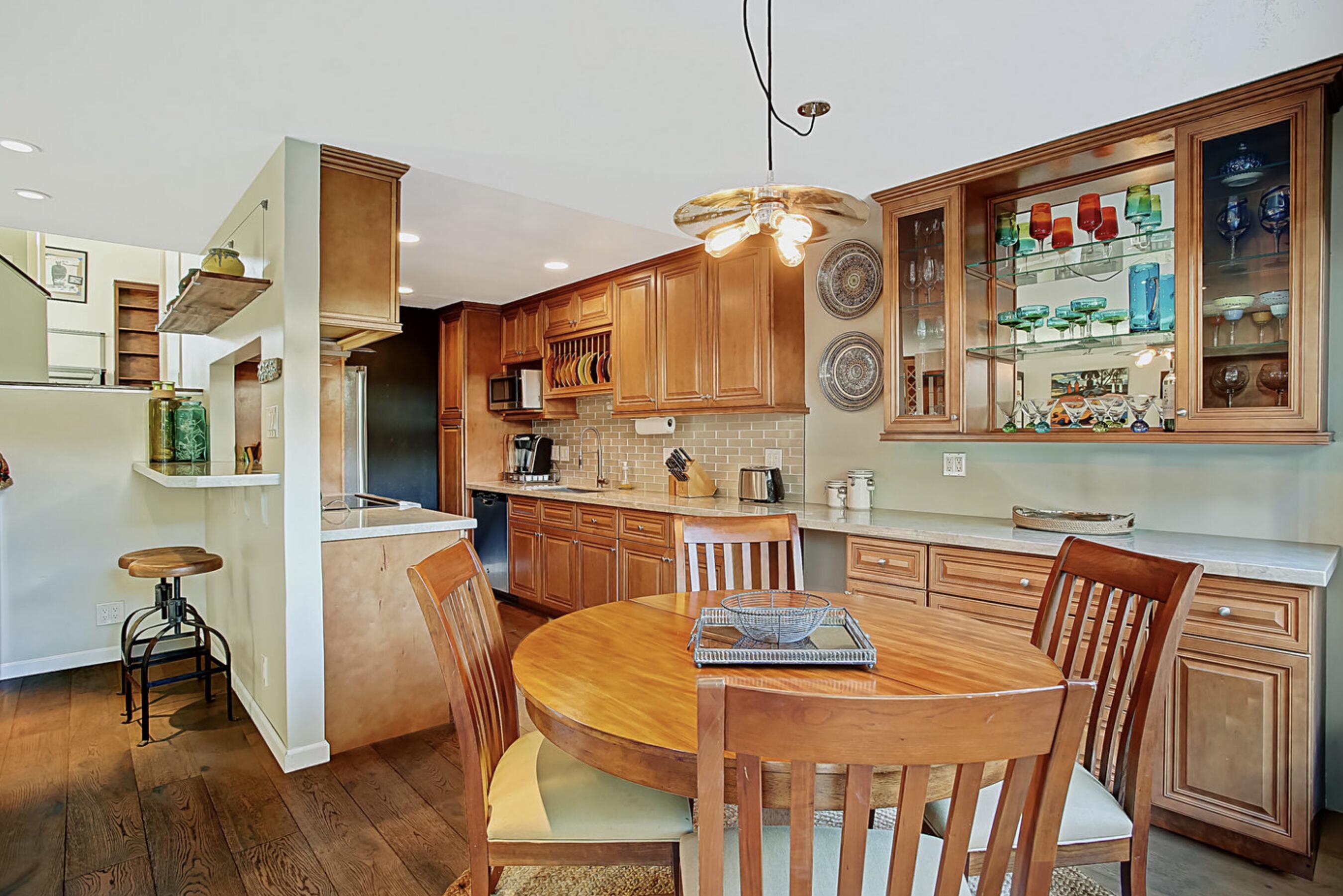 669 Del Parque Drive, Unit D Santa Barbara, CA 93103 - Photo 10 of 37 a view of a dining room with furniture and wooden floor