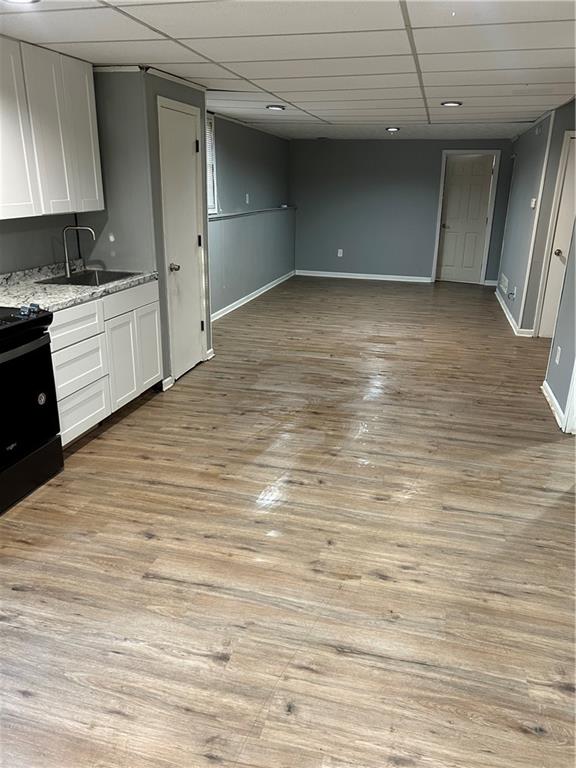 3637 Windmill Road Ellenwood, GA 30294 - Photo 2 of 6 a view of a kitchen with wooden floor and a sink