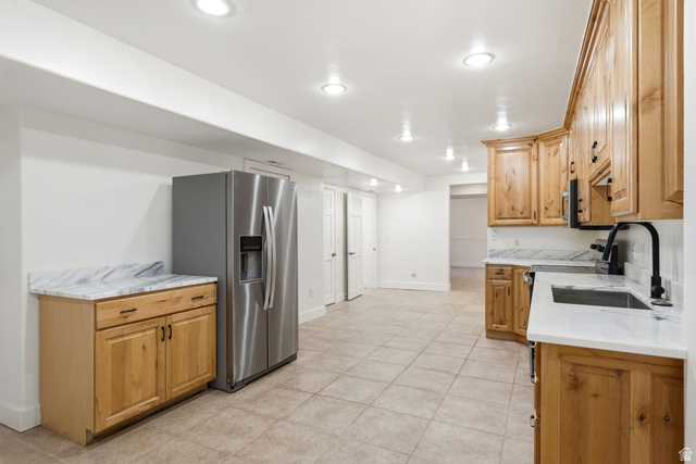 3027 Homestead Road Park City, UT 84098 - Photo 42 of 62 Kitchenette featuring natural wood cabinetry, light-toned tiled flooring, white countertops with veining, a stainless steel refrigerator, and recessed lighting