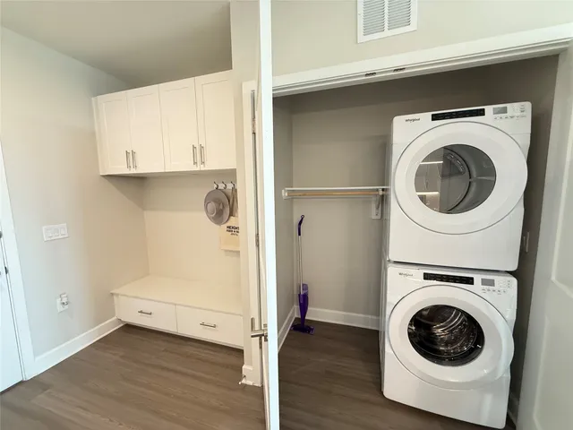 a utility room with sink dryer and washer