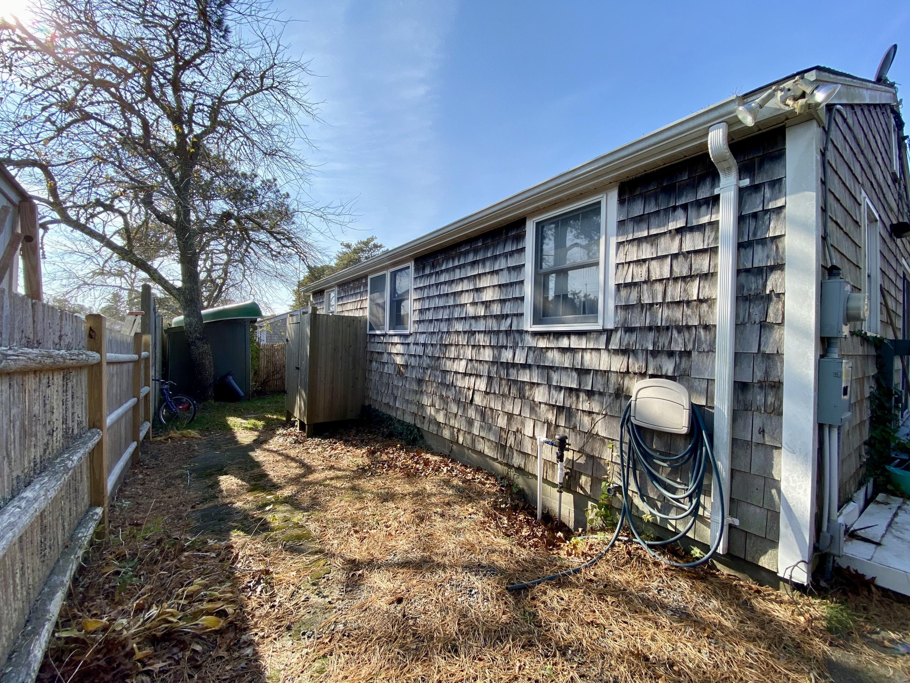 42 Wixon Road Dennis Port, MA 02639 - Photo 13 of 19 Back of House with Outdoor Shower