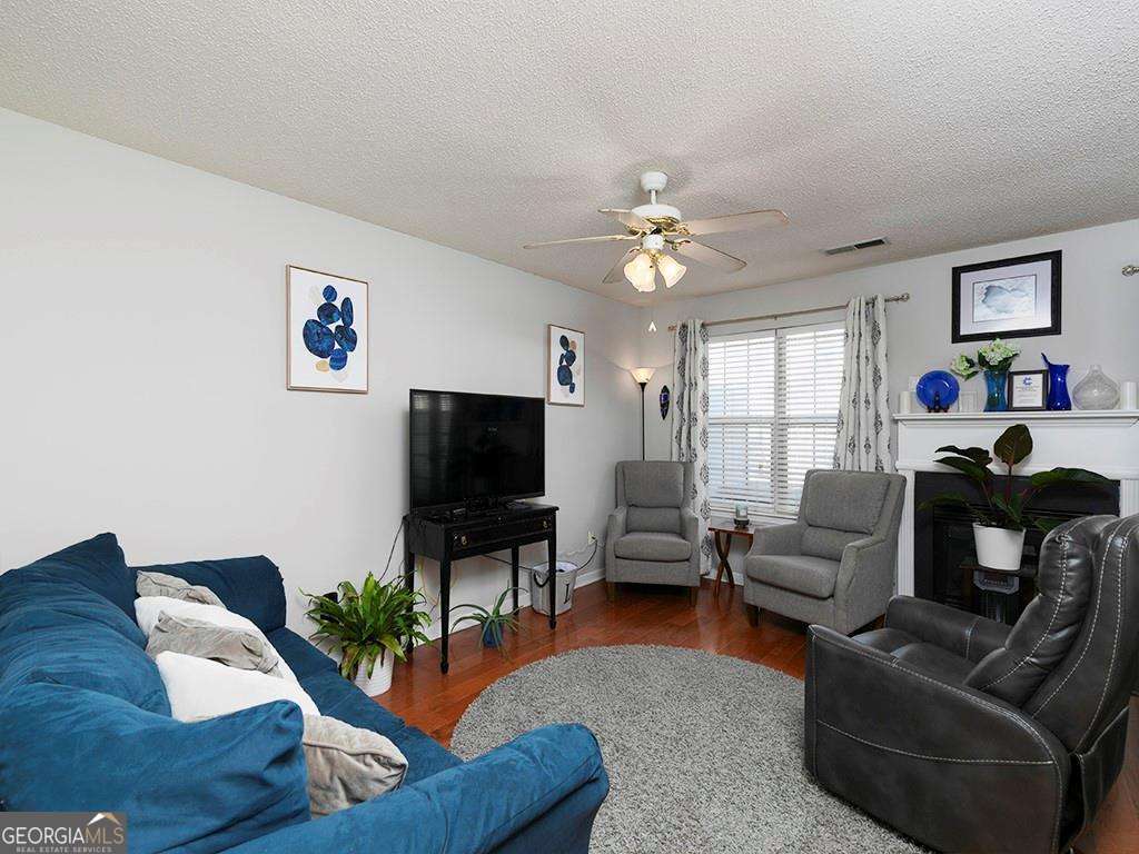 253 Gallant Court Southeast, Unit 17 Mableton, GA 30126 - Photo 15 of 20 a living room with furniture and a flat screen tv