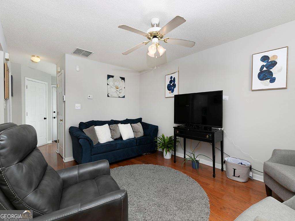 253 Gallant Court Southeast, Unit 17 Mableton, GA 30126 - Photo 18 of 20 a living room with furniture and a flat screen tv