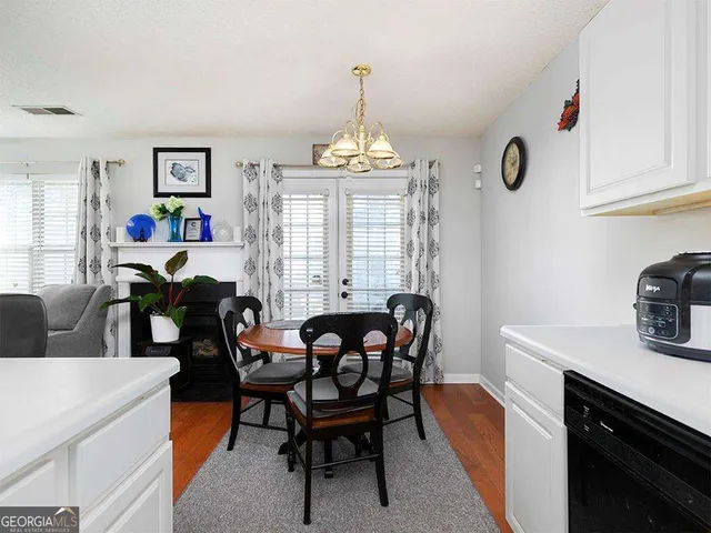 a view of a dining room with furniture and window