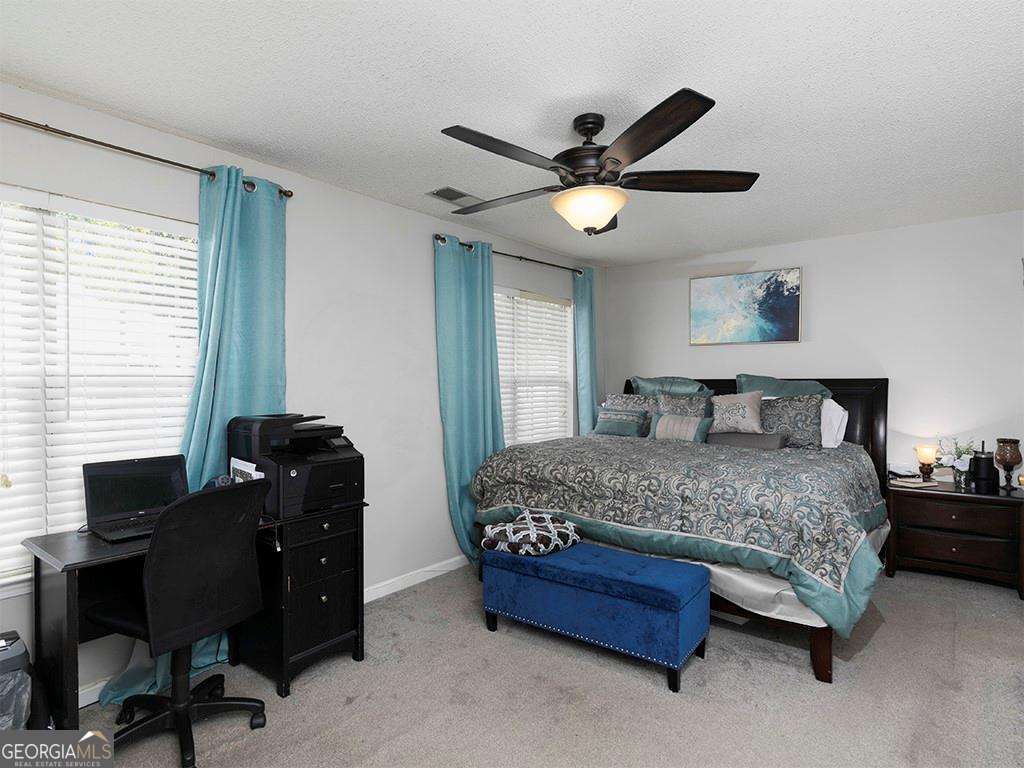 253 Gallant Court Southeast, Unit 17 Mableton, GA 30126 - Photo 10 of 20 a bedroom with a bed and a window