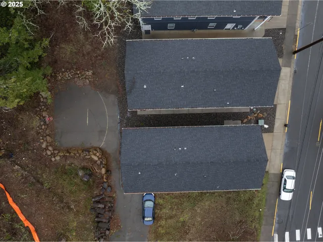 an aerial view of house with yard
