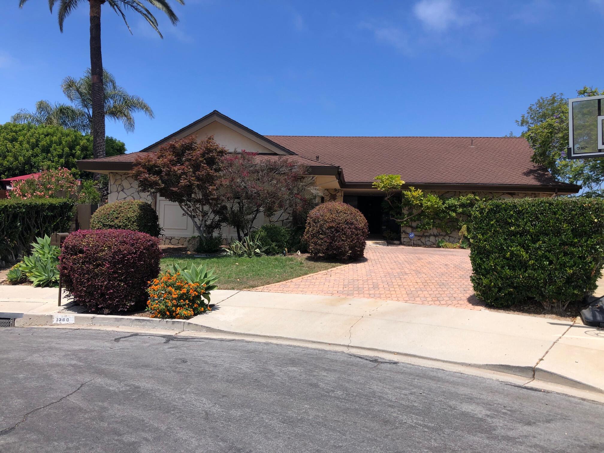 1360 Rialto Lane Santa Barbara, CA 93105 - Photo 1 of 1 a view of a garden with a bench