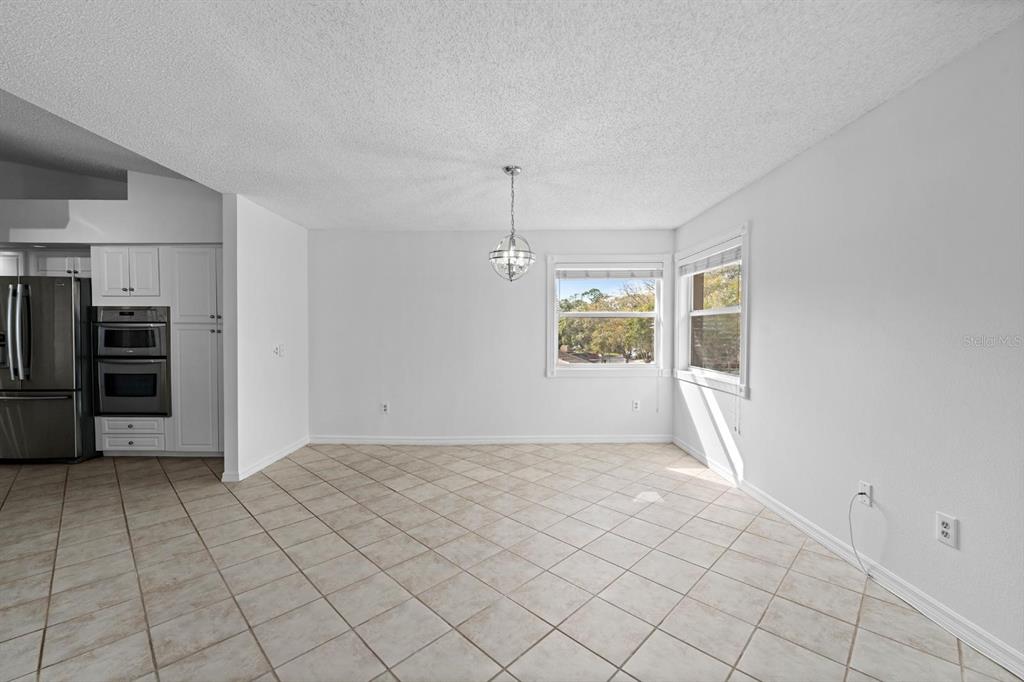 1227 Clays Trail Oldsmar, FL 34677 - Photo 16 of 37 a view of an empty room with window and refrigerator