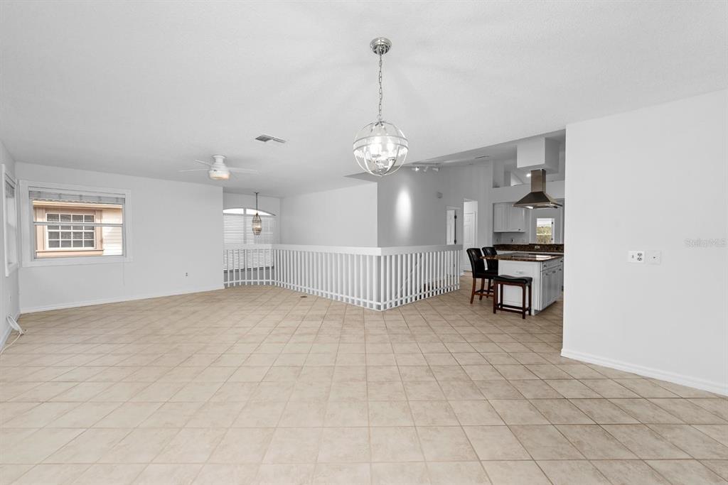 1227 Clays Trail Oldsmar, FL 34677 - Photo 19 of 37 a view of a livingroom with furniture and a chandelier