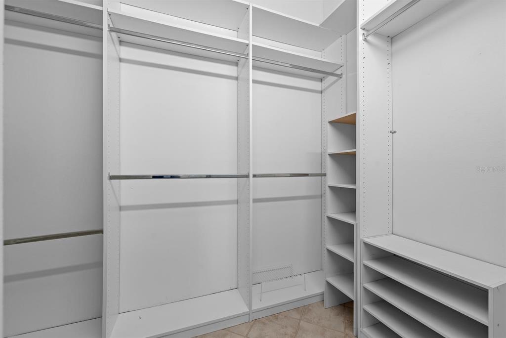 1227 Clays Trail Oldsmar, FL 34677 - Photo 26 of 37 a view of walk in closet with empty racks