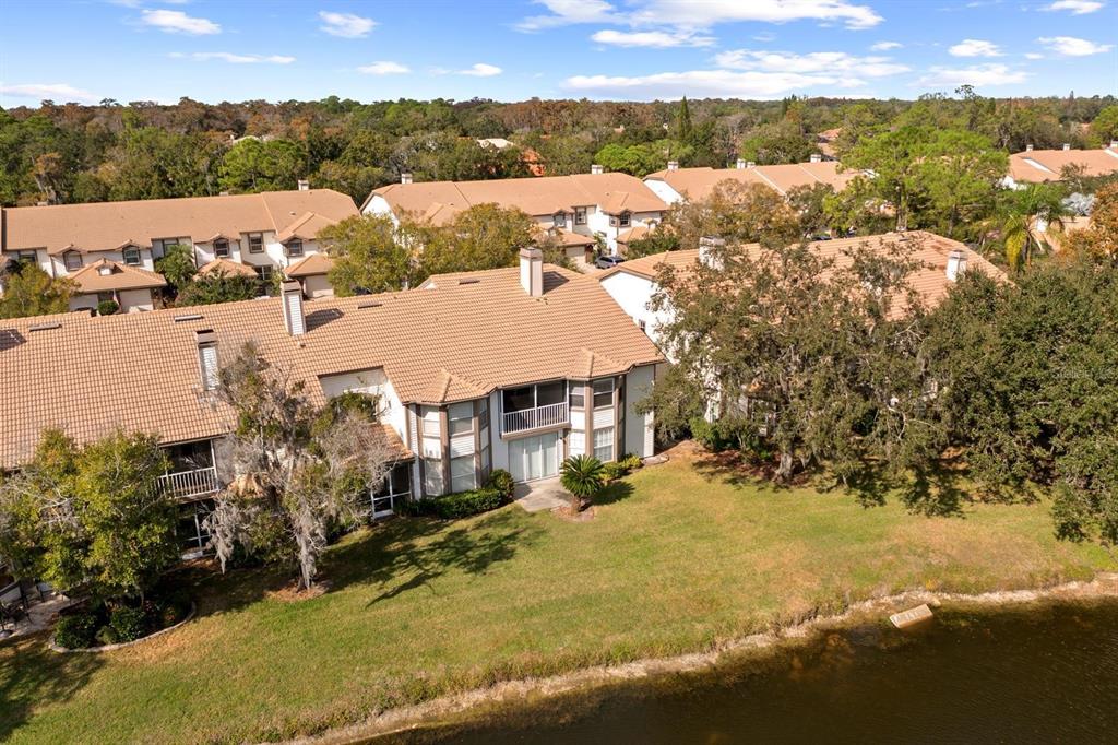 1227 Clays Trail Oldsmar, FL 34677 - Photo 28 of 37 a view of residential houses with outdoor space and ocean view
