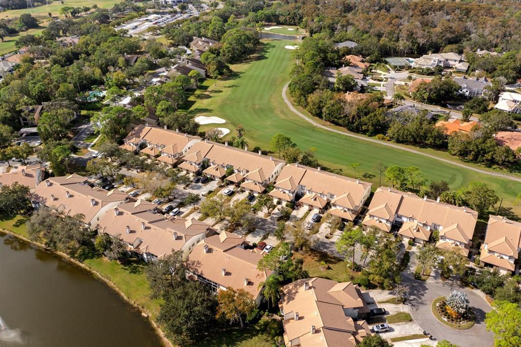 1227 Clays Trail Oldsmar, FL 34677 - Photo 29 of 37 an aerial view of a house with a yard and lake view