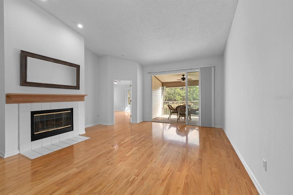 1227 Clays Trail Oldsmar, FL 34677 - Photo 10 of 37 a living room with a fireplace and a table