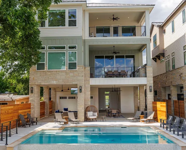 a front view of a building with glass windows and a table
