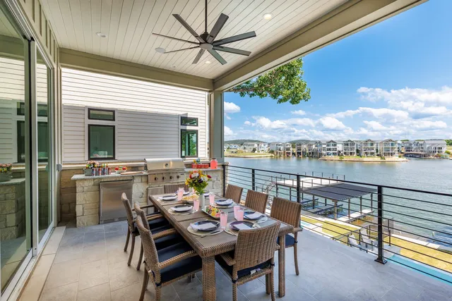 a view of a balcony with a table and chairs