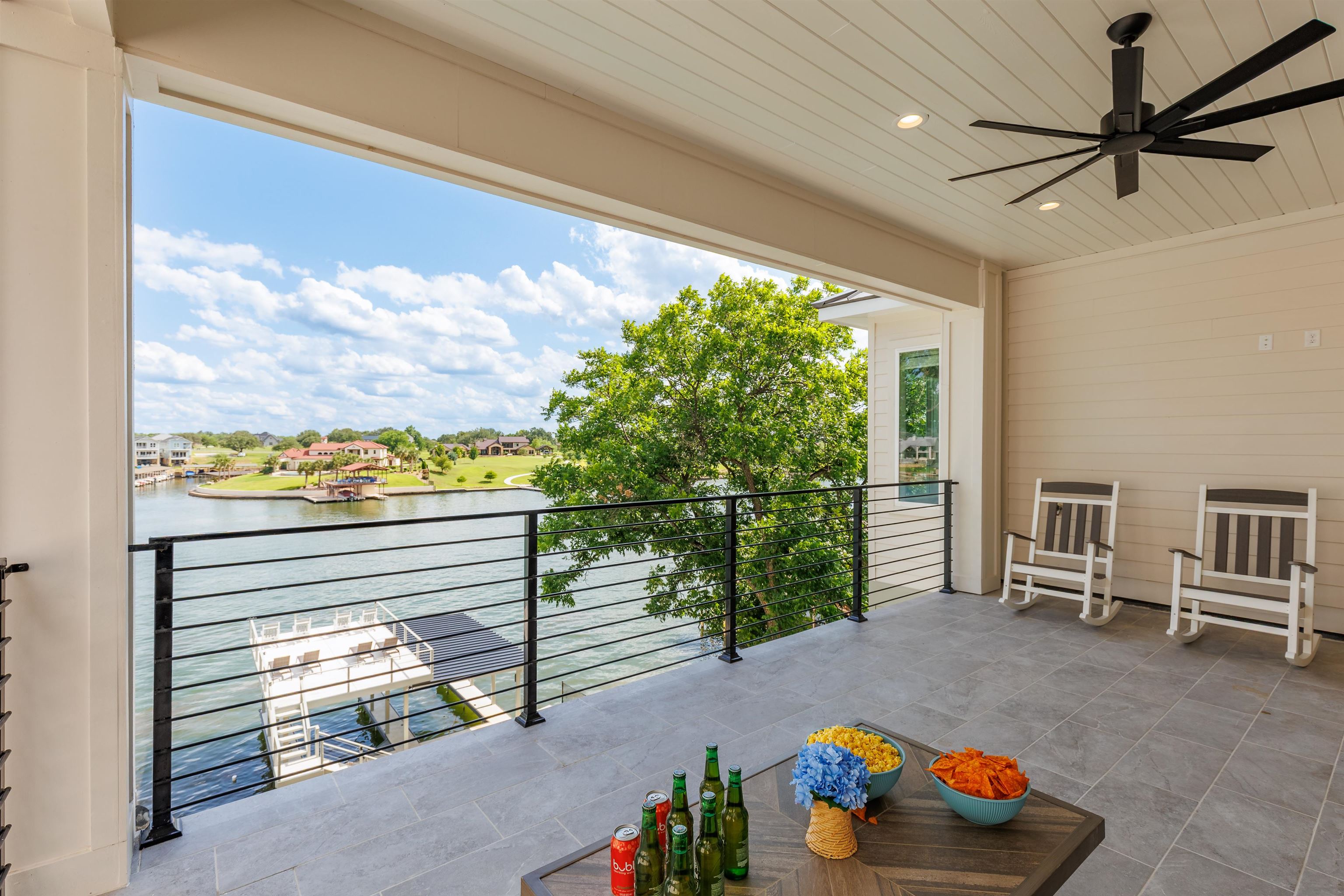 563 Ellen Williams Loop Kingsland, TX 78639 - Photo 21 of 30 Upper Balcony featuring a water view and ceiling fan.