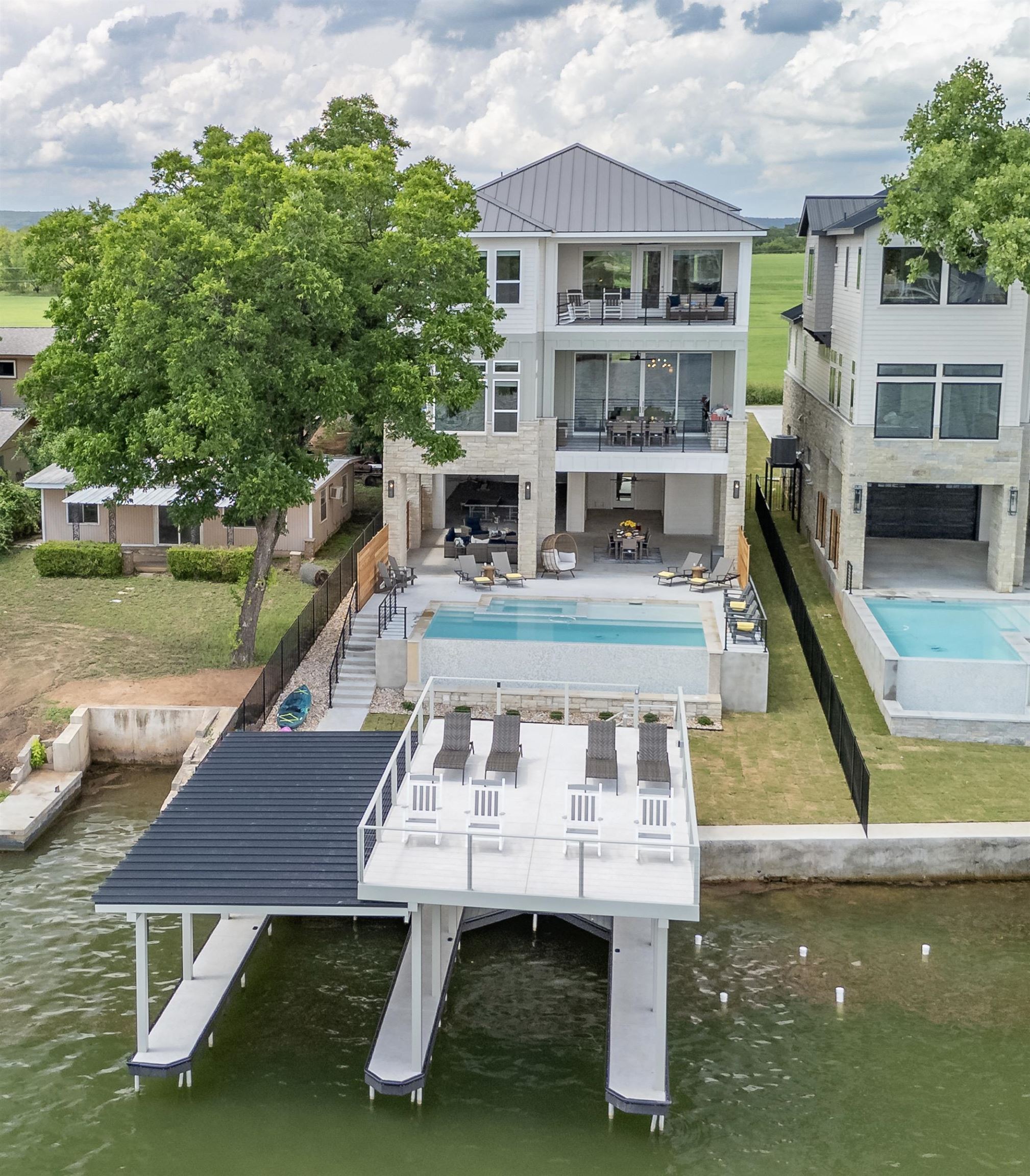 563 Ellen Williams Loop Kingsland, TX 78639 - Photo 3 of 30 2025 Luxury New Construction! 50ft of Open Water on the Colorado river!