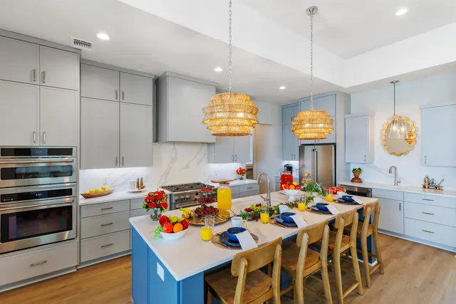 a group of dining room with furniture and wooden floor