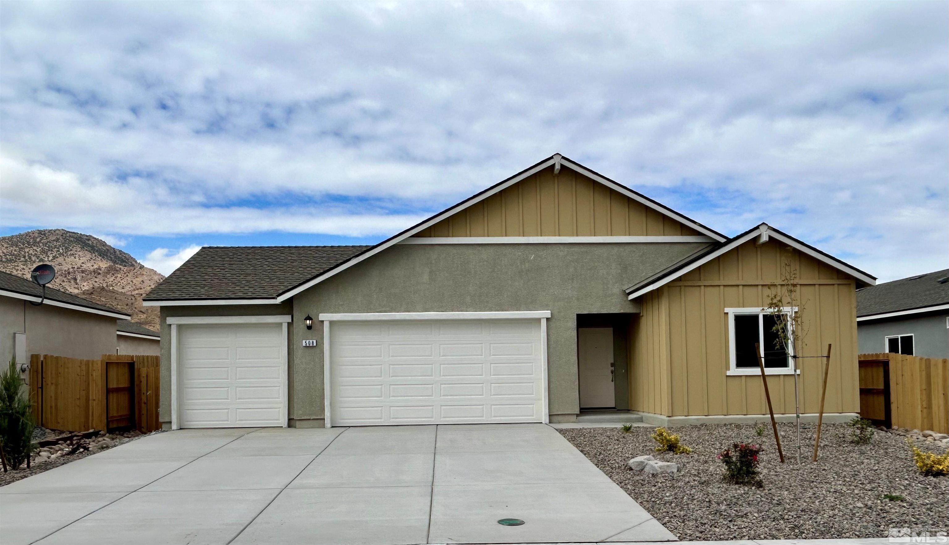 508 Russell Road, Unit LOT #96 Dayton, NV 89403 - Photo 1 of 17 a front view of a house with garage